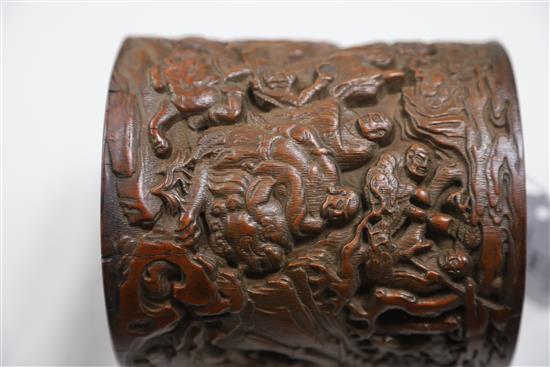 A Chinese bamboo eighteen luohan brush pot, late Qing dynasty, H.14cm